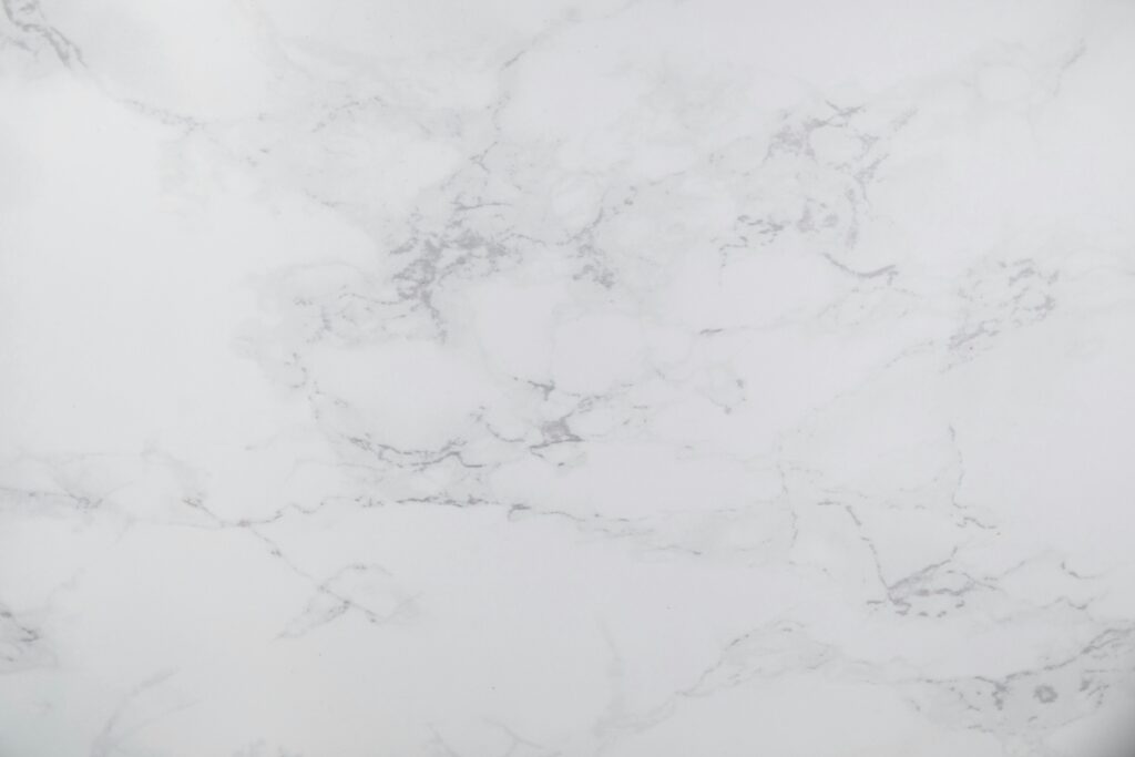 White marble texture with subtle gray veins, perfect for design backgrounds.