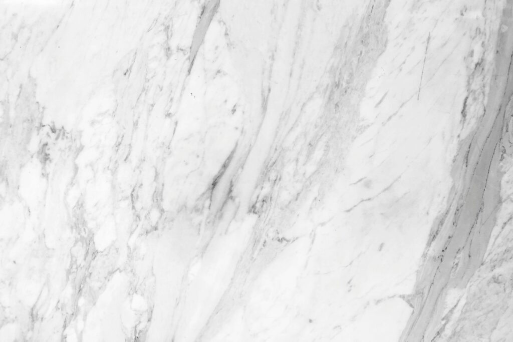 High-resolution white marble texture with natural patterns, perfect for backgrounds.